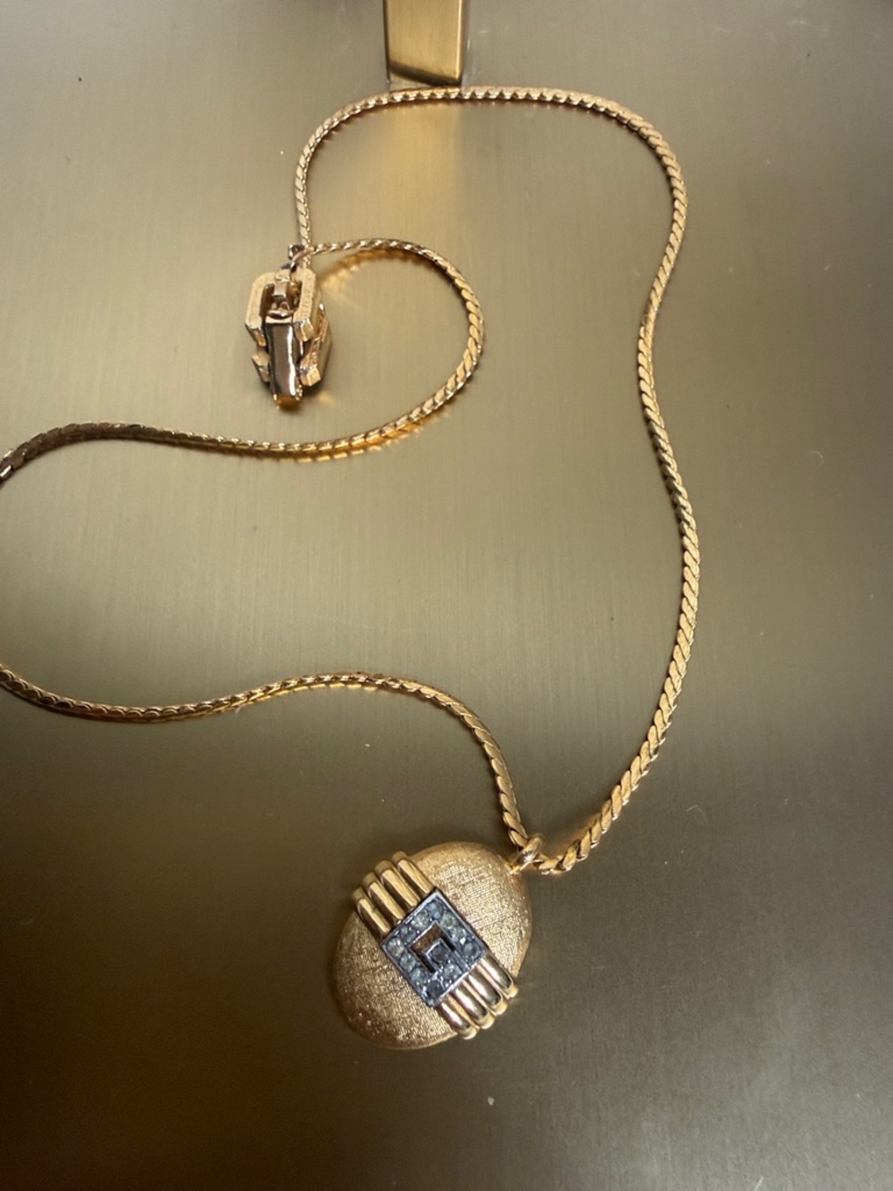 Givenchy Gold-Tone Pendant Necklace with Textured Medallion Diamond Like stones